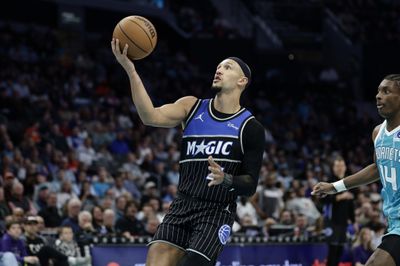 Mar 19, 2026; Charlotte, North Carolina, USA; Orlando Magic guard Jalen Suggs (4) drives to the basket during the third quarter against the Charlotte Hornets at Spectrum Center. Mandatory Credit: Brian Westerholt-Imagn Images