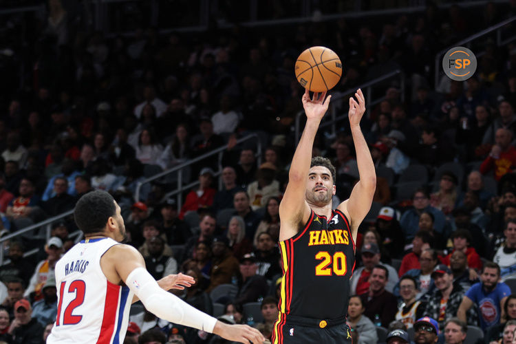 Feb 23, 2025; Atlanta, Georgia, USA; Atlanta Hawks forward Georges Niang (20) attempts three-point shot against Detroit Pistons forward Tobias Harris (12) during the third quarter at State Farm Arena. Credit: Jordan Godfree-Imagn Images