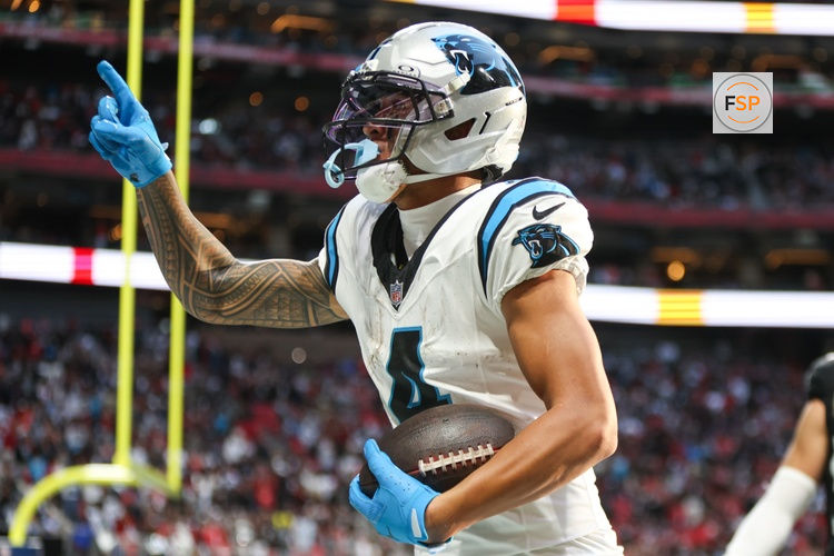 Nov 16, 2025; Atlanta, Georgia, USA; Carolina Panthers wide receiver Tetairoa McMillan (4) celebrates a touchdown in the fourth quarter against the Atlanta Falcons at Mercedes-Benz Stadium. Credit: Brett Davis-Imagn Images