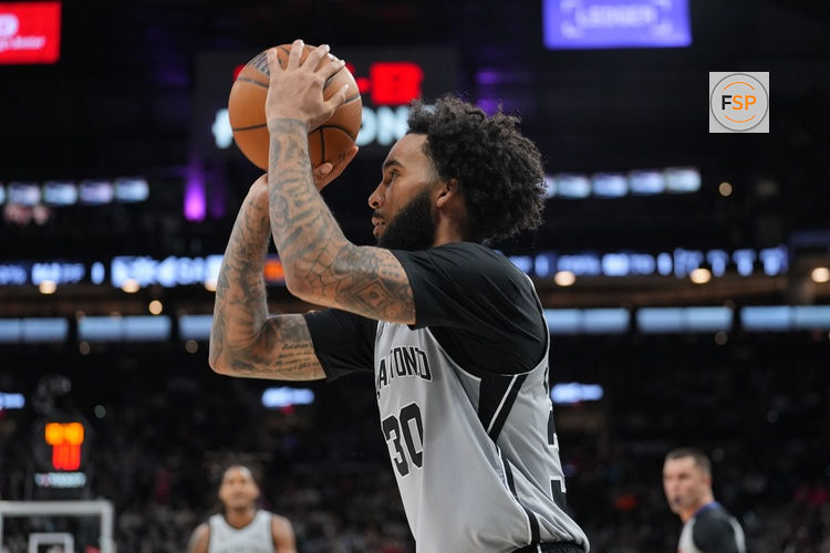 Mar 8, 2026; San Antonio, Texas, USA;  San Antonio Spurs forward Julian Champagnie (30) shoots in the second half against the Houston Rockets at Frost Bank Center. Credit: Daniel Dunn-Imagn Images