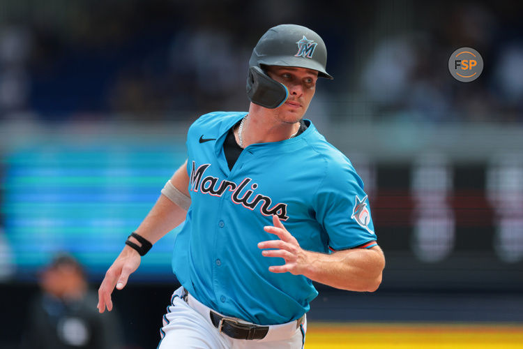 Apr 13, 2025; Miami, Florida, USA; Miami Marlins left fielder Griffin Conine (18) runs past third base to score on a sacrifice fly by Miami Marlins catcher Liam Hicks (not pictured) during the sixth inning at loanDepot Park. Credit: Sam Navarro-Imagn Images