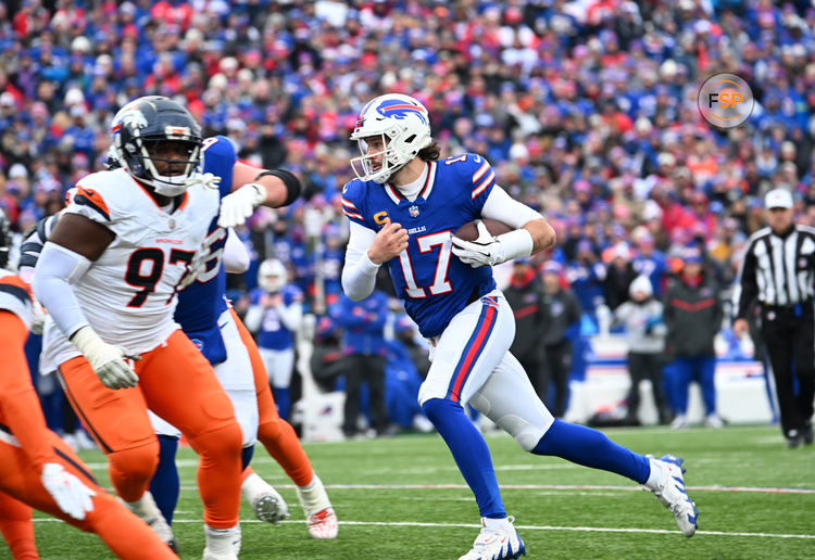 Jan 12, 2025; Orchard Park, New York, USA; Buffalo Bills quarterback Josh Allen (17) runs for a gain during the second quarter against the Denver Broncos in an AFC wild card game at Highmark Stadium. Credit: Mark Konezny-Imagn Images