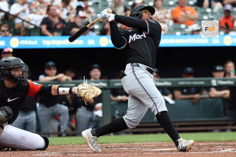 Jul 12, 2025; Baltimore, Maryland, USA; Miami Marlins shortstop Xavier Edwards (9) hits a double during the eighth inning against the Baltimore Orioles at Oriole Park at Camden Yards. Credit: Daniel Kucin Jr.-Imagn Images