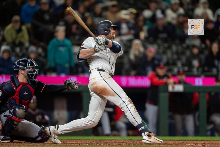 Mar 28, 2026; Seattle, Washington, USA; Seattle Mariners right fielder Luke Raley (20) hits a two-run home run during the tenth inning against the Cleveland Guardians at T-Mobile Park. Credit: Stephen Brashear-Imagn Images