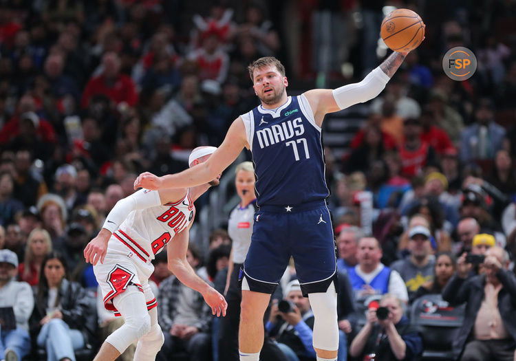 CHICAGO, IL - MARCH 11: Luka Doncic #77 of the Dallas Mavericks grabs a ball during the first half against the Chicago Bulls at United Center on March 11, 2024 in Chicago, Illinois. (Photo by Melissa Tamez/Icon Sportswire)