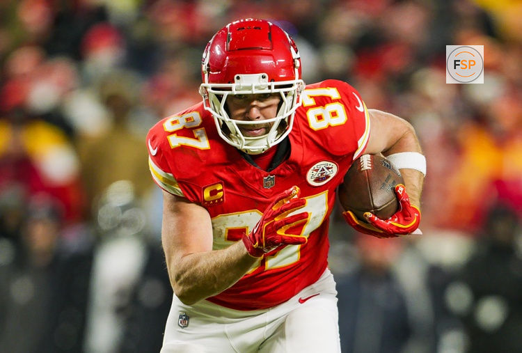 Jan 18, 2025; Kansas City, Missouri, USA; Kansas City Chiefs tight end Travis Kelce (87) runs with the ball during the second half against Houston Texans in a 2025 AFC divisional round game at GEHA Field at Arrowhead Stadium. Credit: Jay Biggerstaff-Imagn Images