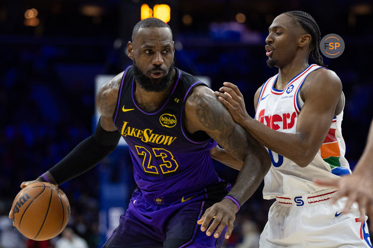 Jan 28, 2025; Philadelphia, Pennsylvania, USA; Los Angeles Lakers forward LeBron James (23) controls the ball against Philadelphia 76ers guard Tyrese Maxey (0) during the second quarter at Wells Fargo Center. Credit: Bill Streicher-Imagn Images