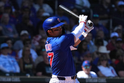 Mar 4, 2025; Mesa, Arizona, USA; Chicago Cubs outfielder Seiya Suzuki (27) hits against the San Diego Padres in the first inning at Sloan Park. Mandatory Credit: Rick Scuteri-Imagn Images