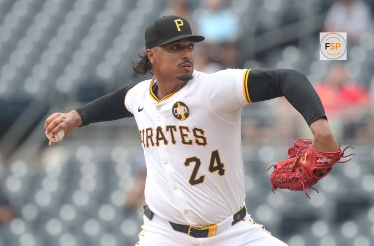 Aug 20, 2025; Pittsburgh, Pennsylvania, USA;  Pittsburgh Pirates starting pitcher Johan Oviedo (24) delivers a pitch against the Toronto Blue Jays during the first inning at PNC Park. Credit: Charles LeClaire-Imagn Images