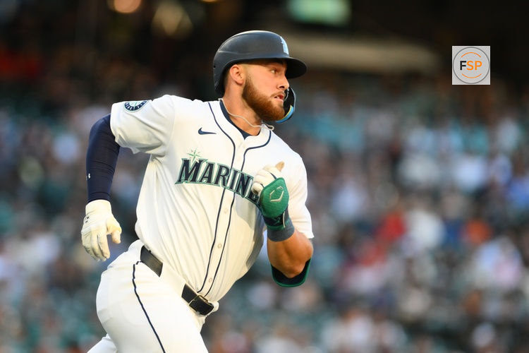 Jul 23, 2024; Seattle, Washington, USA; Seattle Mariners first baseman Tyler Locklear (27) runs towards first base after hitting a single against the Los Angeles Angels during the second inning at T-Mobile Park. Credit: Steven Bisig-USA TODAY Sports