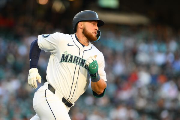 Jul 23, 2024; Seattle, Washington, USA; Seattle Mariners first baseman Tyler Locklear (27) runs towards first base after hitting a single against the Los Angeles Angels during the second inning at T-Mobile Park. Mandatory Credit: Steven Bisig-USA TODAY Sports