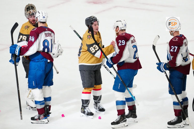 May 26, 2026; Las Vegas, Nevada, USA; Colorado Avalanche defenseman Brent Burns (84) and center Nathan MacKinnon (29) congratulate Vegas Golden Knights goaltender Carter Hart (79) and right wing Mitch Marner (93) after the loss in game four of the Western Conference Final of the 2026 Stanley Cup Playoffs at T-Mobile Arena. Credit: Stephen R. Sylvanie-Imagn Images