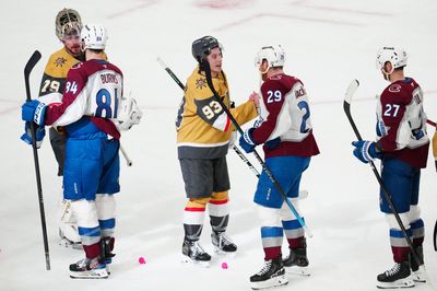 May 26, 2026; Las Vegas, Nevada, USA; Colorado Avalanche defenseman Brent Burns (84) and center Nathan MacKinnon (29) congratulate Vegas Golden Knights goaltender Carter Hart (79) and right wing Mitch Marner (93) after the loss in game four of the Western Conference Final of the 2026 Stanley Cup Playoffs at T-Mobile Arena. Mandatory Credit: Stephen R. Sylvanie-Imagn Images