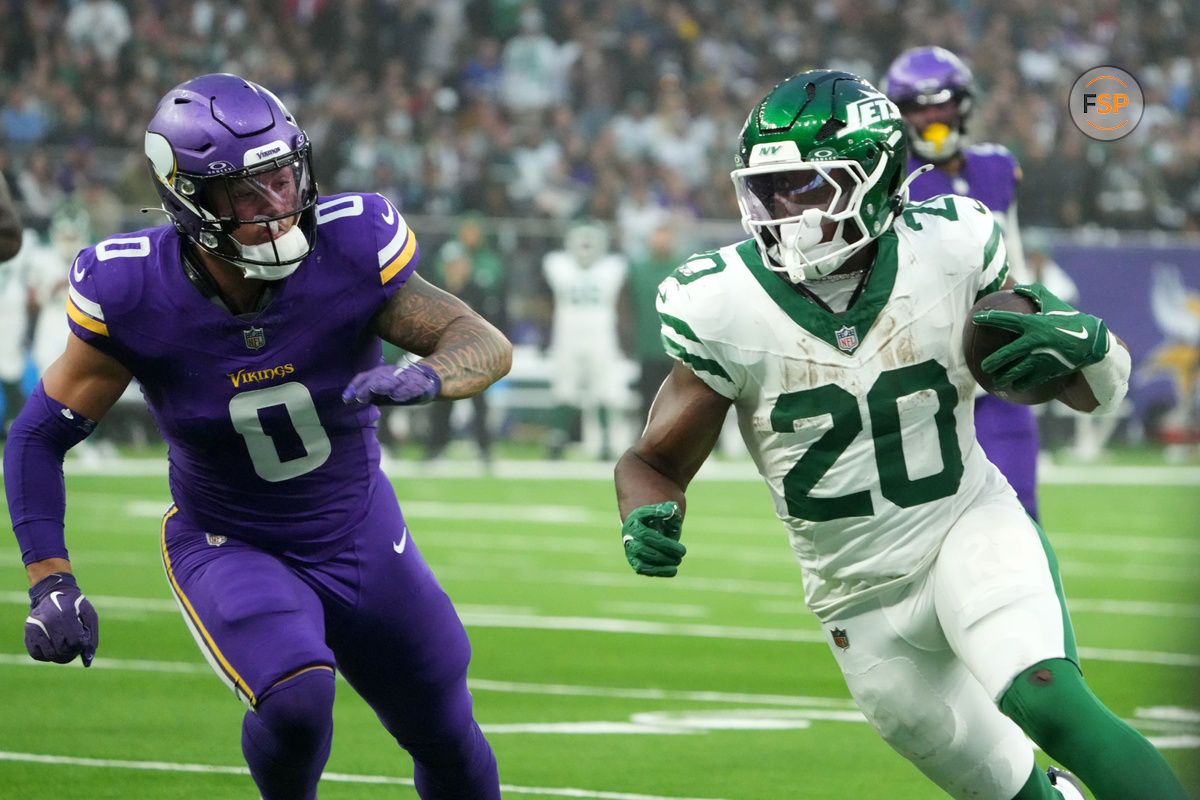 Oct 6, 2024; London, United Kingdom; New York Jets running back Breece Hall (20) carries the ball against Minnesota Vikings linebacker Ivan Pace Jr. (0) in the second half at Tottenham Hotspur Stadium. Credit: Kirby Lee-Imagn Images