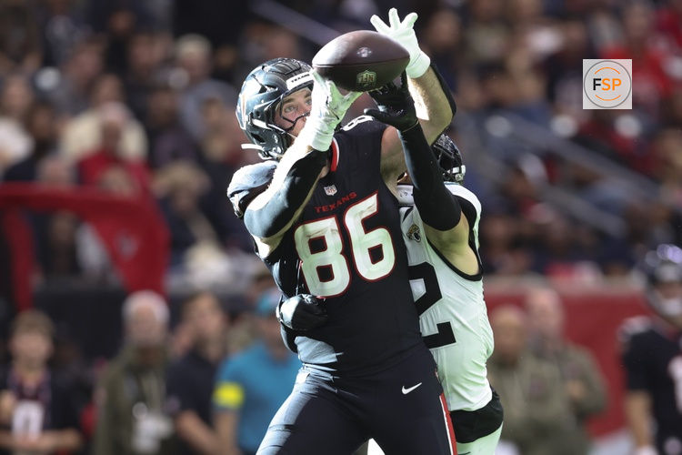 Nov 9, 2025; Houston, Texas, USA; Houston Texans tight end Dalton Schultz (86) attempts to make a recption as Jacksonville Jaguars safety Andrew Wingard (42) defends during the fourth quarter at NRG Stadium. Credit: Troy Taormina-Imagn Images