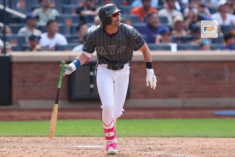 Jul 20, 2025; New York City, New York, USA; New York Mets designated hitter Jeff McNeil (1) doubles during the eighth inning against the Cincinnati Reds at Citi Field. Credit: Vincent Carchietta-Imagn Images