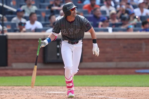 Jul 20, 2025; New York City, New York, USA; New York Mets designated hitter Jeff McNeil (1) doubles during the eighth inning against the Cincinnati Reds at Citi Field. Mandatory Credit: Vincent Carchietta-Imagn Images