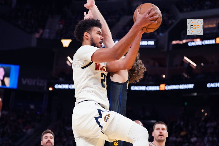 Feb 22, 2026; San Francisco, California, USA;  Denver Nuggets forward Cameron Johnson (23) drives to the basket against Golden State Warriors guard Brandin Podziemski (2) in the third quarter at Chase Center. Credit: David Gonzales-Imagn Images