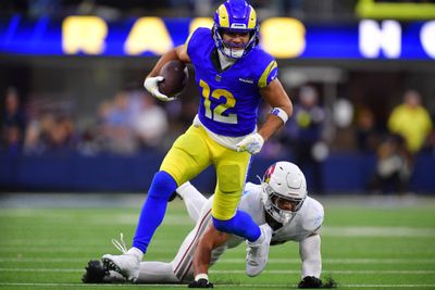 Jan 4, 2026; Inglewood, California, USA;  Los Angeles Rams wide receiver Puka Nacua (12) runs after the catch as Arizona Cardinals linebacker Cody Simon (50) defends during the second half at SoFi Stadium. Mandatory Credit: Gary A. Vasquez-Imagn Images