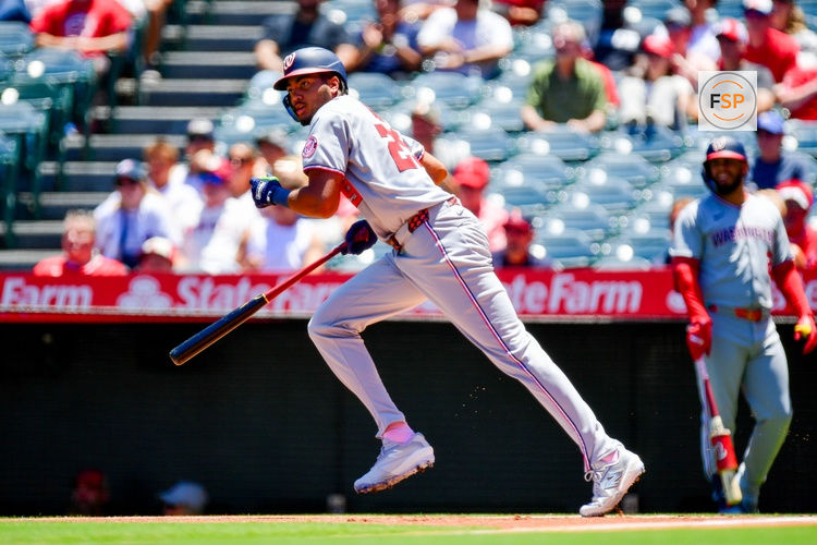 Jun 29, 2025; Anaheim, California, USA;  Washington Nationals left fielder James Wood (29) hits a single against the Los Angeles Angels during the first inning at Angel Stadium. Credit: Gary A. Vasquez-Imagn Images