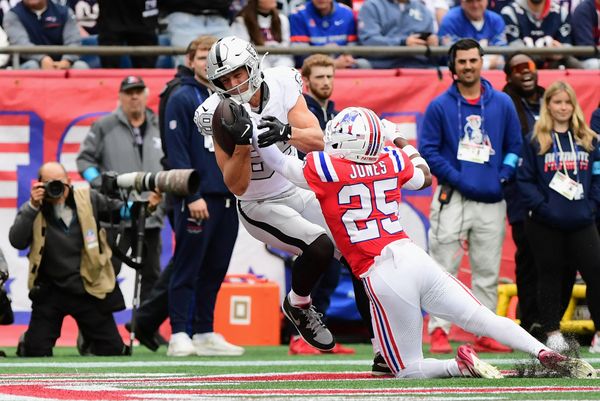 Oct 11, 2026; Foxborough, Massachusetts, USA;  Las Vegas Raiders tight end Brock Bowers (89) catches a thirteen-yard touchdown pass from quarterback Kirk Cousins (not pictured) against New England Patriots cornerback Marcus Jones (25) during the first quarter at Gillette Stadium.  Mandatory Credit: Bob DeChiara-Imagn Images