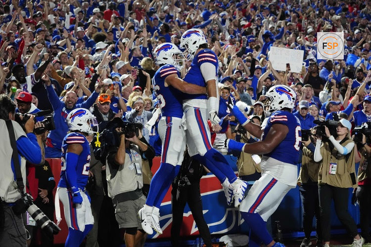 Sep 23, 2024; Orchard Park, New York, USA; Buffalo Bills quarterback Josh Allen (17) celebrates a touchdown with Buffalo Bills tight end Dalton Kincaid (86) during the first half at Highmark Stadium. Credit: Gregory Fisher-Imagn Images