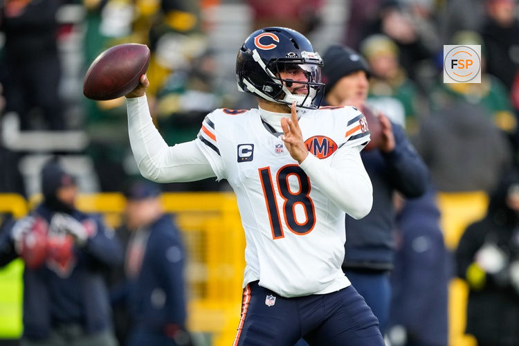 Dec 7, 2025; Green Bay, Wisconsin, USA; Chicago Bears quarterback Caleb Williams (18) warms up before the game against the Green Bay Packers at Lambeau Field. Credit: Jeff Hanisch-Imagn Images