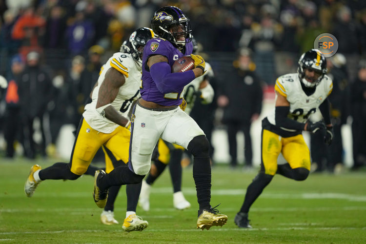 Jan 11, 2025; Baltimore, Maryland, USA; Baltimore Ravens running back Derrick Henry (22) runs to score a touchdown in the third quarter against the Pittsburgh Steelers in an AFC wild card game at M&T Bank Stadium. Credit: Mitch Stringer-Imagn Images