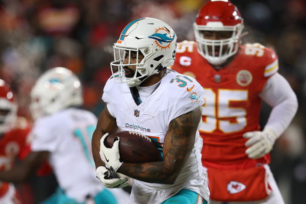 KANSAS CITY, MO - JANUARY 13: Miami Dolphins running back Raheem Mostert (31) carries the ball in the first quarter of an AFC Wild Card playoff game between the Miami Dolphins and Kansas City Chiefs on Jan 13, 2024 at GEHA Field at Arrowhead Stadium in Kansas City, MO. (Photo by Scott Winters/Icon Sportswire)