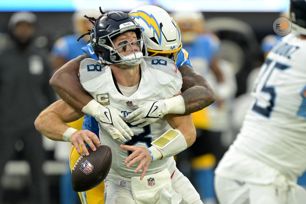 Nov 10, 2024; Inglewood, California, USA;  Tennessee Titans quarterback Will Levis (8) is sacked by Los Angeles Chargers linebacker Bud Dupree (48) in the second half at SoFi Stadium. Credit: Jayne Kamin-Oncea-Imagn Images