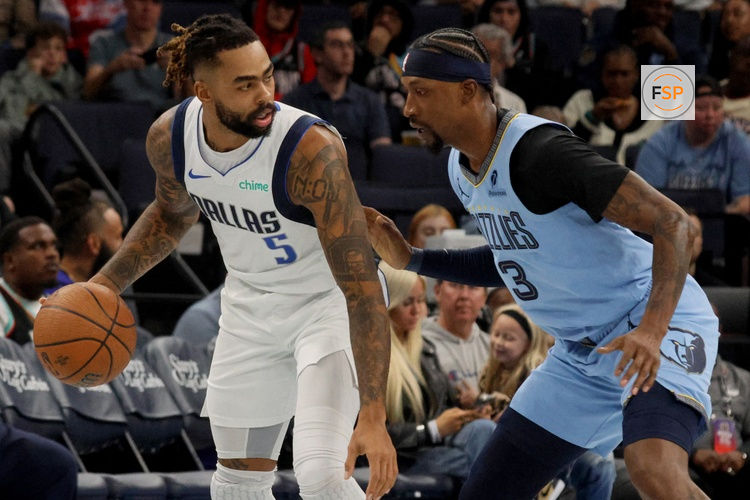 Nov 7, 2025; Memphis, Tennessee, USA; Dallas Mavericks guard D'Angelo Russell (5) looks to pass the ball against Memphis Grizzlies forward Kentavious Caldwell-Pope (3) during the first quarter at FedExForum. Credit: Petre Thomas-Imagn Images