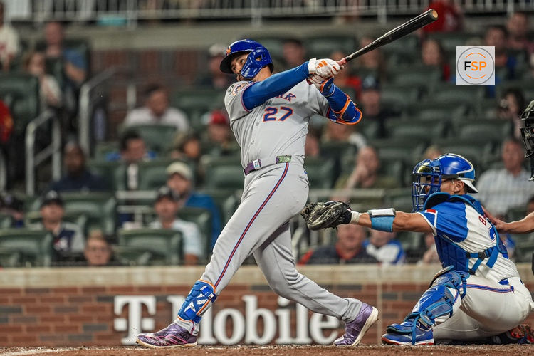 Aug 23, 2025; Cumberland, Georgia, USA; New York Mets third baseman Mark Vientos (27) hits a home run against the Atlanta Braves during the ninth inning at Truist Park. Credit: Dale Zanine-Imagn Images