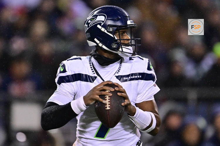 Dec 26, 2024; Chicago, Illinois, USA; Seattle Seahawks quarterback Geno Smith (7) looks to pass against the Chicago Bears during the second quarter at Soldier Field. Credit: Daniel Bartel-Imagn Images