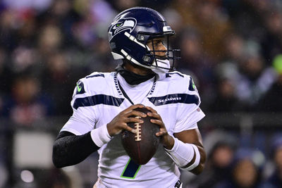 Dec 26, 2024; Chicago, Illinois, USA; Seattle Seahawks quarterback Geno Smith (7) looks to pass against the Chicago Bears during the second quarter at Soldier Field. Mandatory Credit: Daniel Bartel-Imagn Images