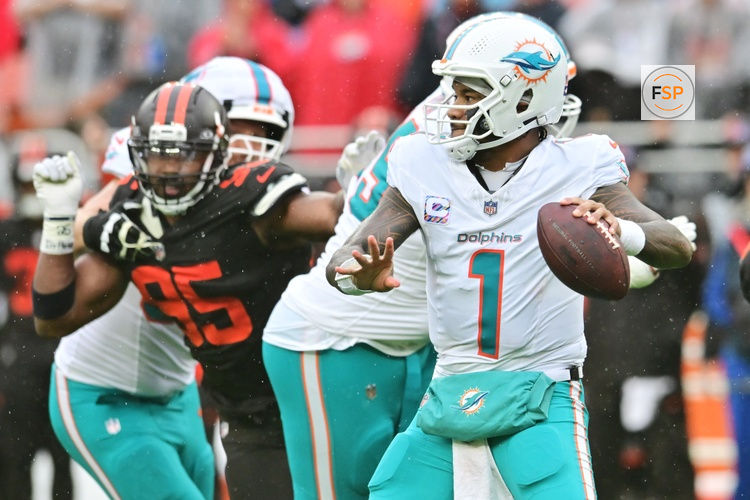 Oct 19, 2025; Cleveland, Ohio, USA; Miami Dolphins quarterback Tua Tagovailoa (1) throws a pass during the first half against the Cleveland Browns at Huntington Bank Field. Credit: Ken Blaze-Imagn Images