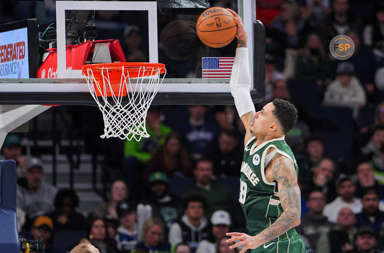 Feb 12, 2025; Minneapolis, Minnesota, USA; Milwaukee Bucks forward Kyle Kuzma (18) dunks against the Minnesota Timberwolves in the second quarter at Target Center. Credit: Brad Rempel-Imagn Images