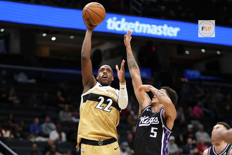 Feb 1, 2026; Washington, District of Columbia, USA; Washington Wizards forward Khris Middleton (22) takes a shot over Sacramento Kings guard Nique Clifford (5) during the first half at Capital One Arena. Credit: Daniel Kucin Jr.-Imagn Images