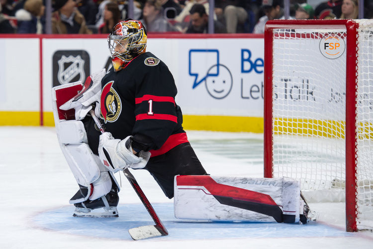 Jan 18, 2025; Ottawa, Ontario, CAN; Ottawa Senators goalie Leevi Merilainen (1) stretches  in the second period against the Boston Bruins at the Canadian Tire Centre. Credit: Marc DesRosiers-Imagn Images