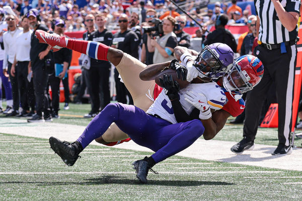 Sep 8, 2024; East Rutherford, New Jersey, USA; Minnesota Vikings wide receiver Jordan Addison (3) is tackled by New York Giants cornerback Dru Phillips (22) during the first half at MetLife Stadium. Mandatory Credit: Vincent Carchietta-Imagn Images