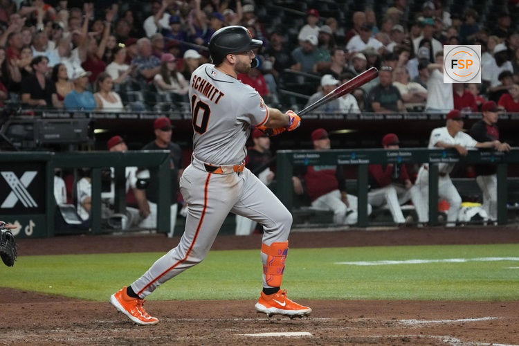 Jun 29, 2026; Phoenix, Arizona, USA; San Francisco Giants left fielder Casey Schmitt (10) hits a RBI sacrifice fly out against the Arizona Diamondbacks in the eighth inning at Chase Field. Credit: Rick Scuteri-Imagn Images