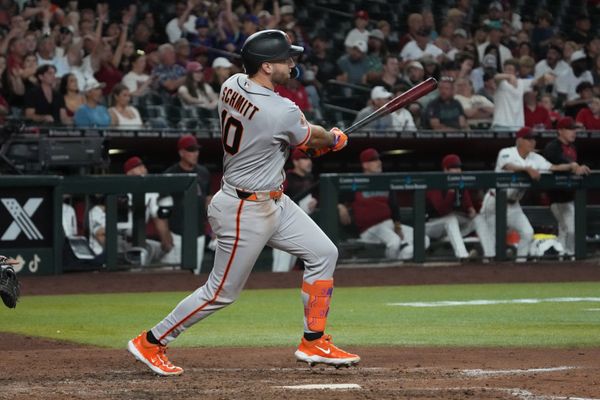 Jun 29, 2026; Phoenix, Arizona, USA; San Francisco Giants left fielder Casey Schmitt (10) hits a RBI sacrifice fly out against the Arizona Diamondbacks in the eighth inning at Chase Field. Mandatory Credit: Rick Scuteri-Imagn Images