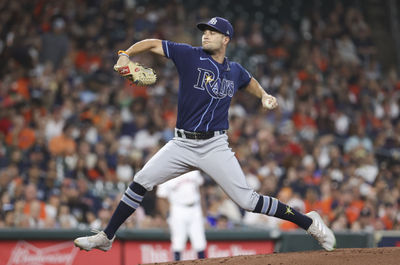 Oct 1, 2022; Houston, Texas, USA; Tampa Bay Rays starting pitcher Shane McClanahan (18) delivers a pitch during the first inning against the Houston Astros at Minute Maid Park. Mandatory Credit: Troy Taormina-USA TODAY Sports