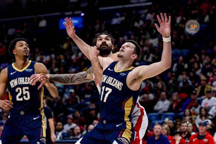 Mar 6, 2025; New Orleans, Louisiana, USA;  New Orleans Pelicans center Karlo Matkovic (17) and Houston Rockets center Steven Adams (12) fights for position on a free throw during the second half at Smoothie King Center. Credit: Stephen Lew-Imagn Images