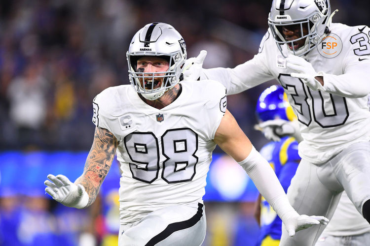 INGLEWOOD, CA - DECEMBER 08: Oakland Raiders defensive end Maxx Crosby (98) celebrates a tackle with safety Duron Harmon (30) during the NFL game between the Oakland Raiders and the Los Angeles Rams on December 8, 2022, at SoFi Stadium in Inglewood, CA. (Photo by Brian Rothmuller/Icon Sportswire)