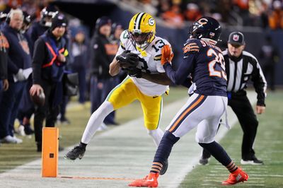 Dec 20, 2025; Chicago, Illinois, USA; Green Bay Packers wide receiver Dontayvion Wicks (13) runs out of bounds after catching a pass against Chicago Bears cornerback Tyrique Stevenson (29) during the second quarter at Soldier Field. Mandatory Credit: Mike Dinovo-Imagn Images
