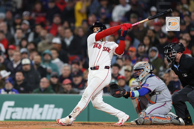 May 20, 2025; Boston, Massachusetts, USA; Boston Red Sox catcher Carlos Narvaez (75) hits a solo home run during the fifth inning against the New York Mets at Fenway Park. Credit: Paul Rutherford-Imagn Images