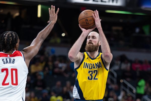 Nov 28, 2025; Indianapolis, Indiana, USA;  Indiana Pacers center Jay Huff (32) shoots the ball while Washington Wizards center Alex Sarr (20) defends in the first half at Gainbridge Fieldhouse. Mandatory Credit: Trevor Ruszkowski-Imagn Images