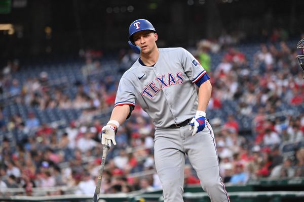 Jun 6, 2025; Washington, District of Columbia, USA; Texas Rangers shortstop Corey Seager (5) tosses his bat after drawing a walk during the fifth inning against the Washington Nationals at Nationals Park. Mandatory Credit: Rafael Suanes-Imagn Images