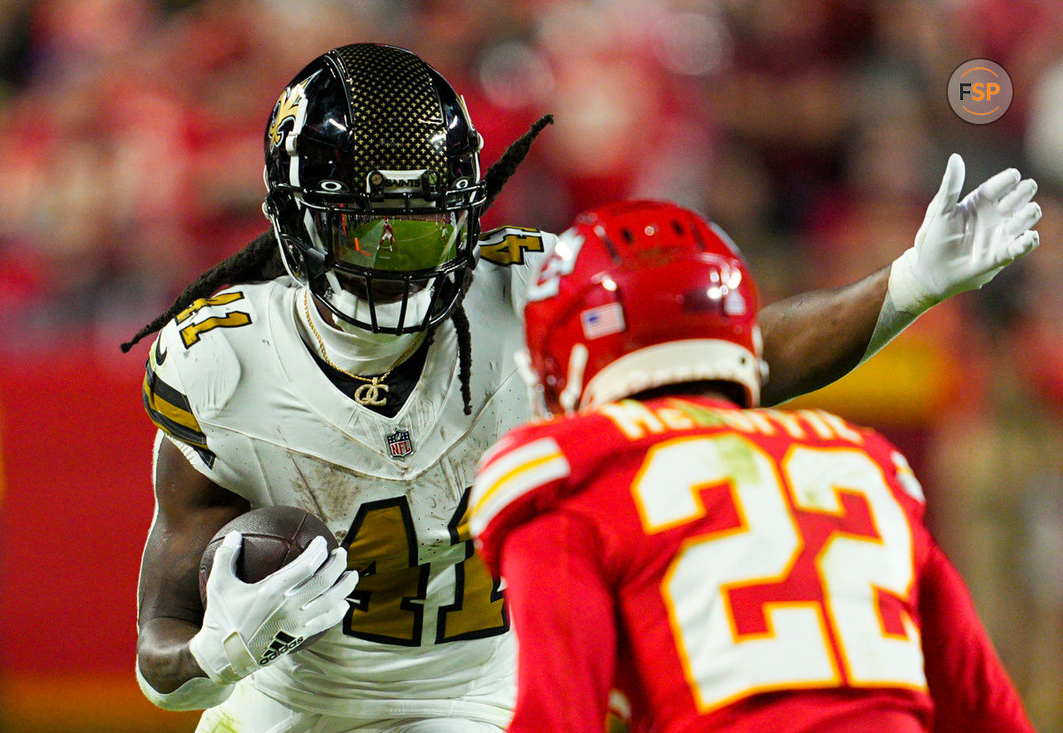 Oct 7, 2024; Kansas City, Missouri, USA; New Orleans Saints running back Alvin Kamara (41) runs the ball against Kansas City Chiefs cornerback Trent McDuffie (22) during the second half at GEHA Field at Arrowhead Stadium. Credit: Jay Biggerstaff-Imagn Images