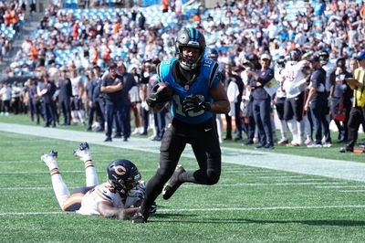 Sep 13, 2026; Charlotte, North Carolina, USA;  Carolina Panthers wide receiver Jalen Coker (18) runs with the ball while defended by Chicago Bears defensive back Tyrique Stevenson (29) in the second half at Bank of America Stadium.  Mandatory Credit: Jim Dedmon-Imagn Images